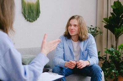 A man talking to a specialist.