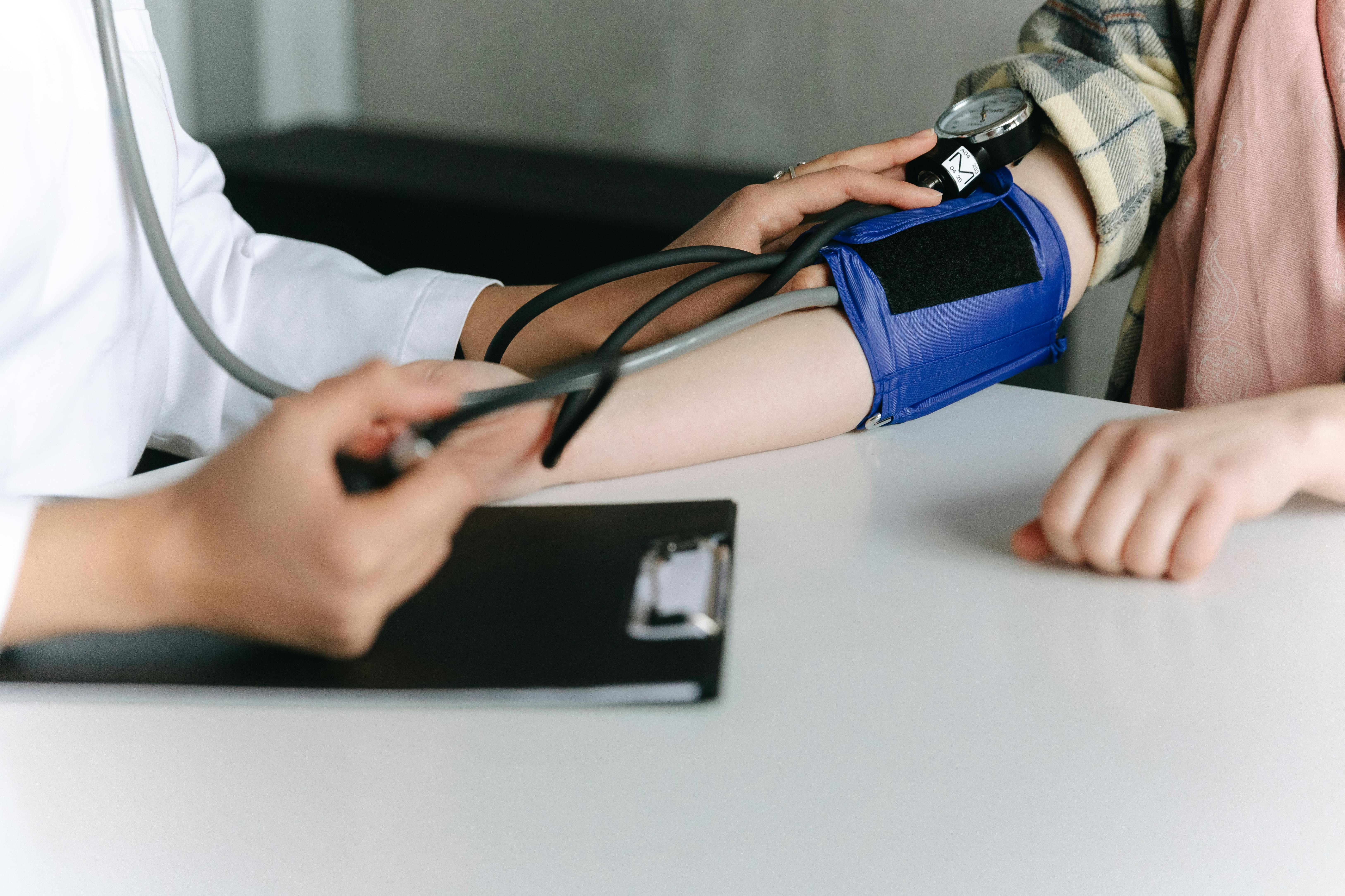 A photo of a woman having a blood pressure reading