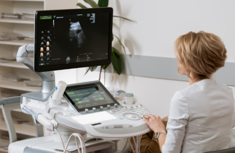 Picture: a radiologist looking at an ultrasound image.