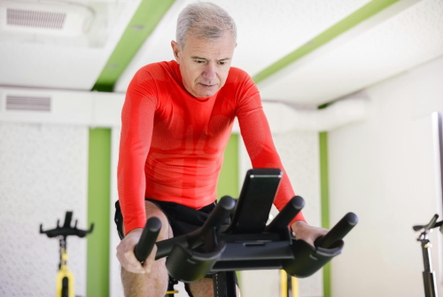 A picture of a middle-aged man on an exercise bike.